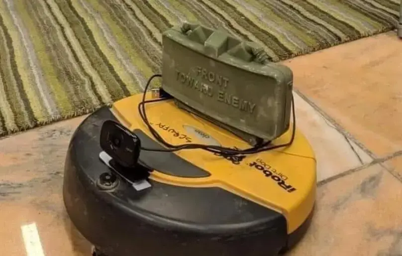 image of a roomba. On top it's got a claymore anti-personnel mine hooked up to a webcam